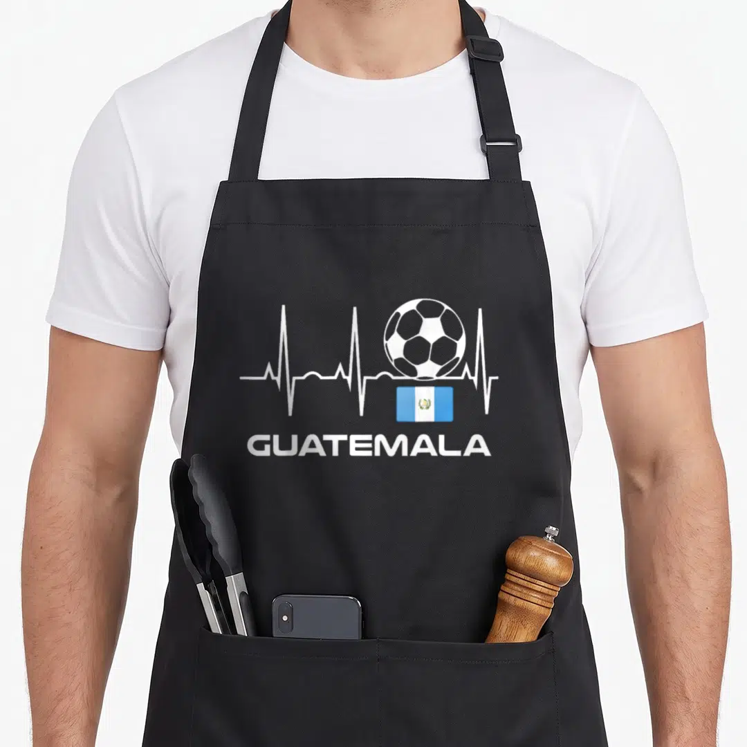 Guatemala guatemalan aprons - Soccer ball on heartbeat line with Guatemala flag and text GUATEMALA — shown on a black cotton canvas apron against a white background