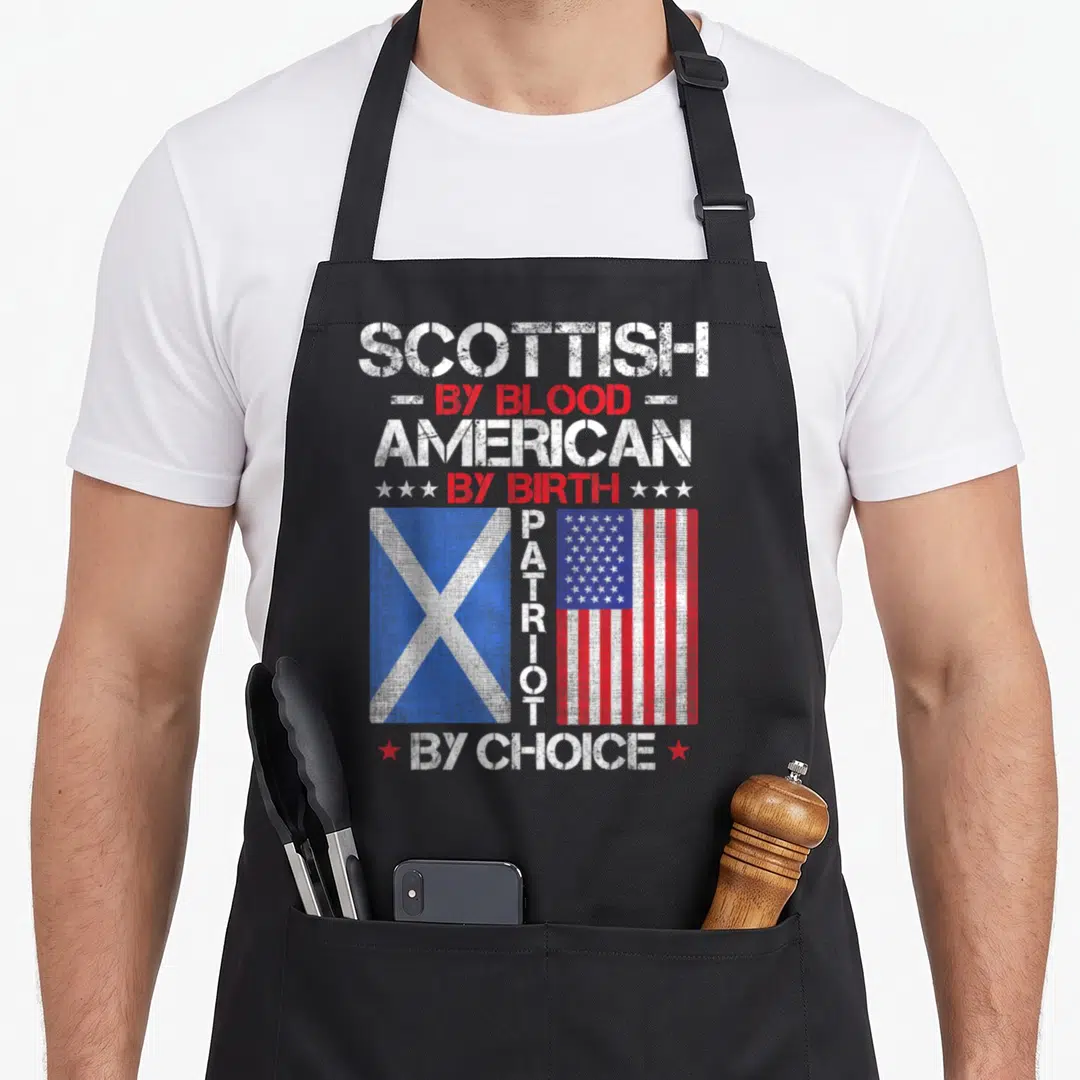 Birth blood apron - Two flags with stacked SCOTTISH AMERICAN PATRIOT text in distressed white red blue — shown on a black cotton canvas apron against a white background