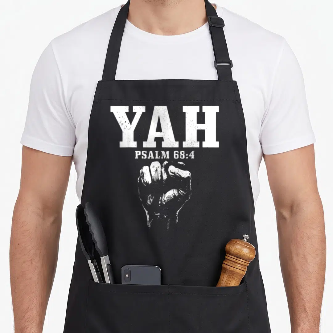 Hebrew israelite jewish apron - White YAH text and clenched fist illustration in distressed style — shown on a black cotton canvas apron against a white background