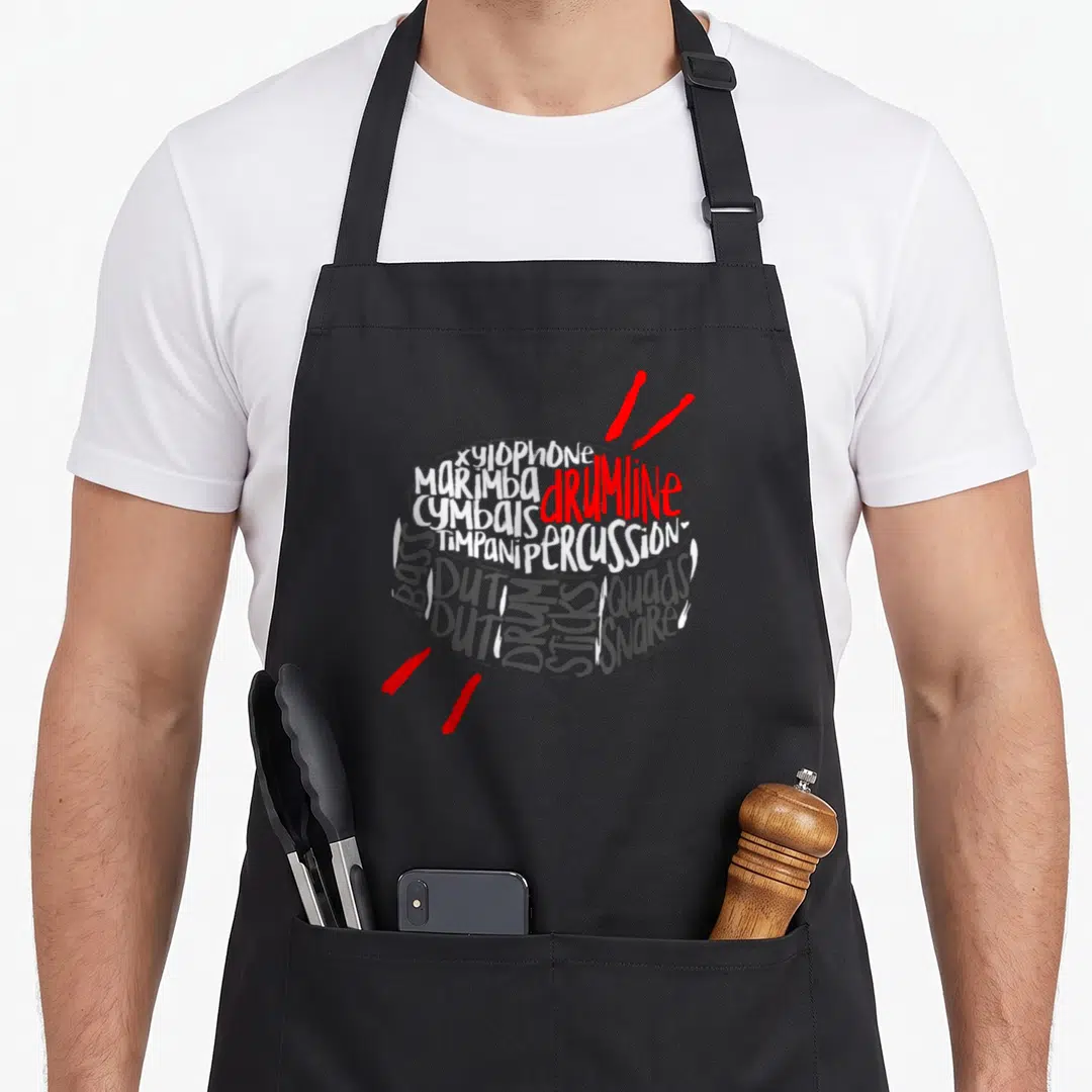 Drumline marching band apron - Typography drum shape formed by words xylophone marimba snare quads with two red sticks — shown on a black cotton canvas apron against a white background