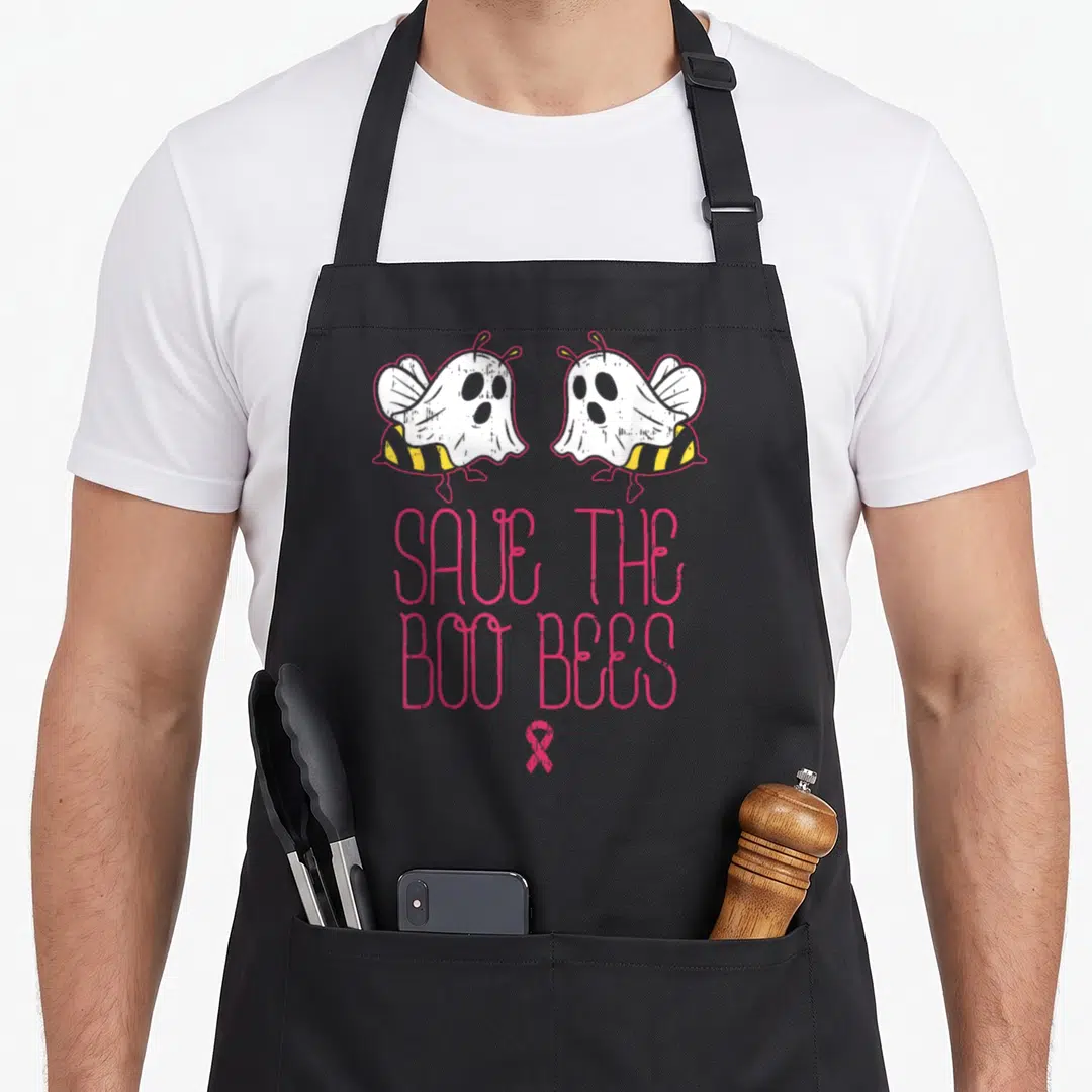 Boobee save the bees apron - Two ghost bees above pink SAVE THE BOO BEES text and pink ribbon — shown on a black cotton canvas apron against a white background