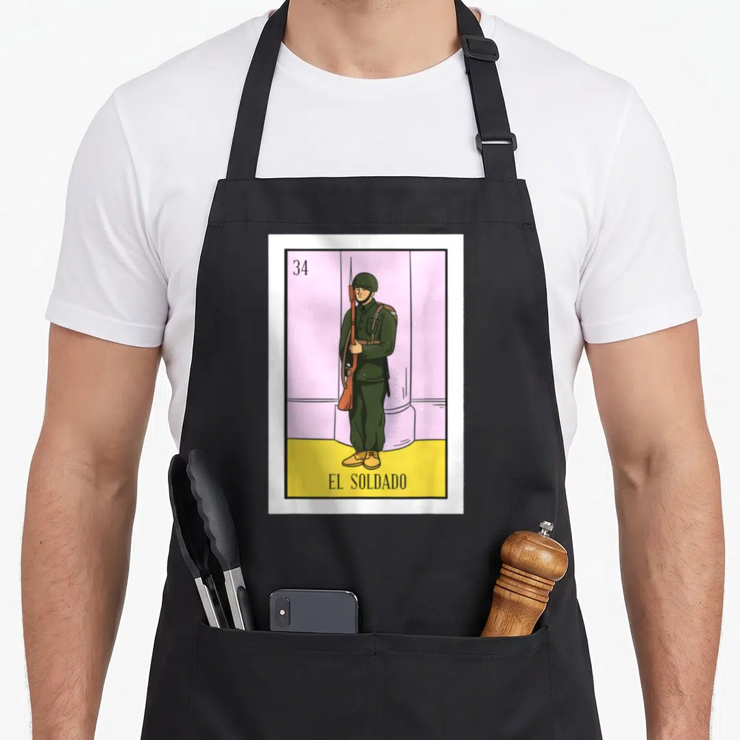Soldado mexican apron - Soldier in green uniform holding rifle stands before pink column on yellow ground with number — shown on a black cotton canvas apron against a white background