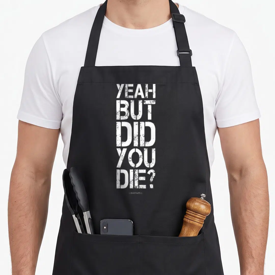 But yeah love apron - White distressed stacked text reading YEAH BUT DID YOU DIE on grey background — shown on a black cotton canvas apron against a white background