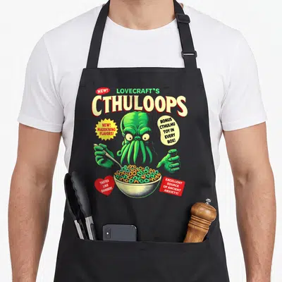 Cthuloop horror apron - Green Cthulhu holding a spoon over a bowl of rings with promotional text — shown on a black cotton canvas apron against a white background