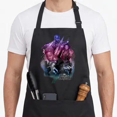Heroine panther apron - Photo collage of Black Panther characters in purple blue and black with geometric shapes — shown on a black cotton canvas apron against a white background