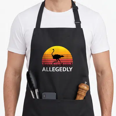 Funny ostrich bird apron - Black ostrich silhouette over yellow orange red striped sun with ALLEGEDLY text below — shown on a black cotton canvas apron against a white background
