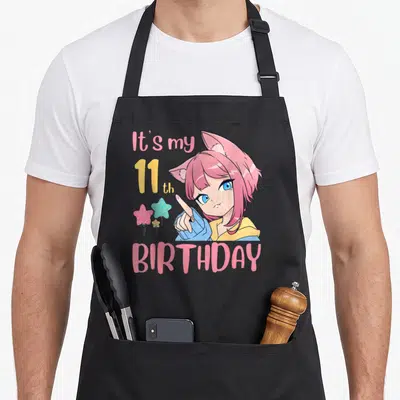 Bday anime mom apron - Anime girl with pink hair and star balloons next to It's my 11th BIRTHDAY text — shown on a black cotton canvas apron against a white background
