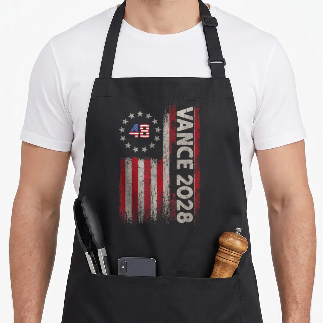 Vance political aprons - Distressed 48 Vance 2028 graphic with stars and red white stripes — shown on a black cotton canvas apron against a white background