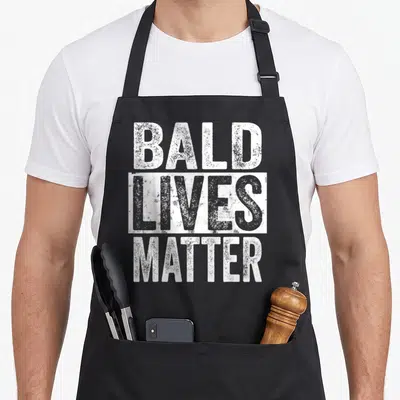 Bald beautiful apron - Distressed white text Bald Lives Matter stacked with middle word in a white rectangle block — shown on a black cotton canvas apron against a white background