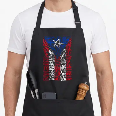 Pueblo rican pride apron - Red white and blue typography map of Puerto Rico cities forming island shape — shown on a black cotton canvas apron against a white background