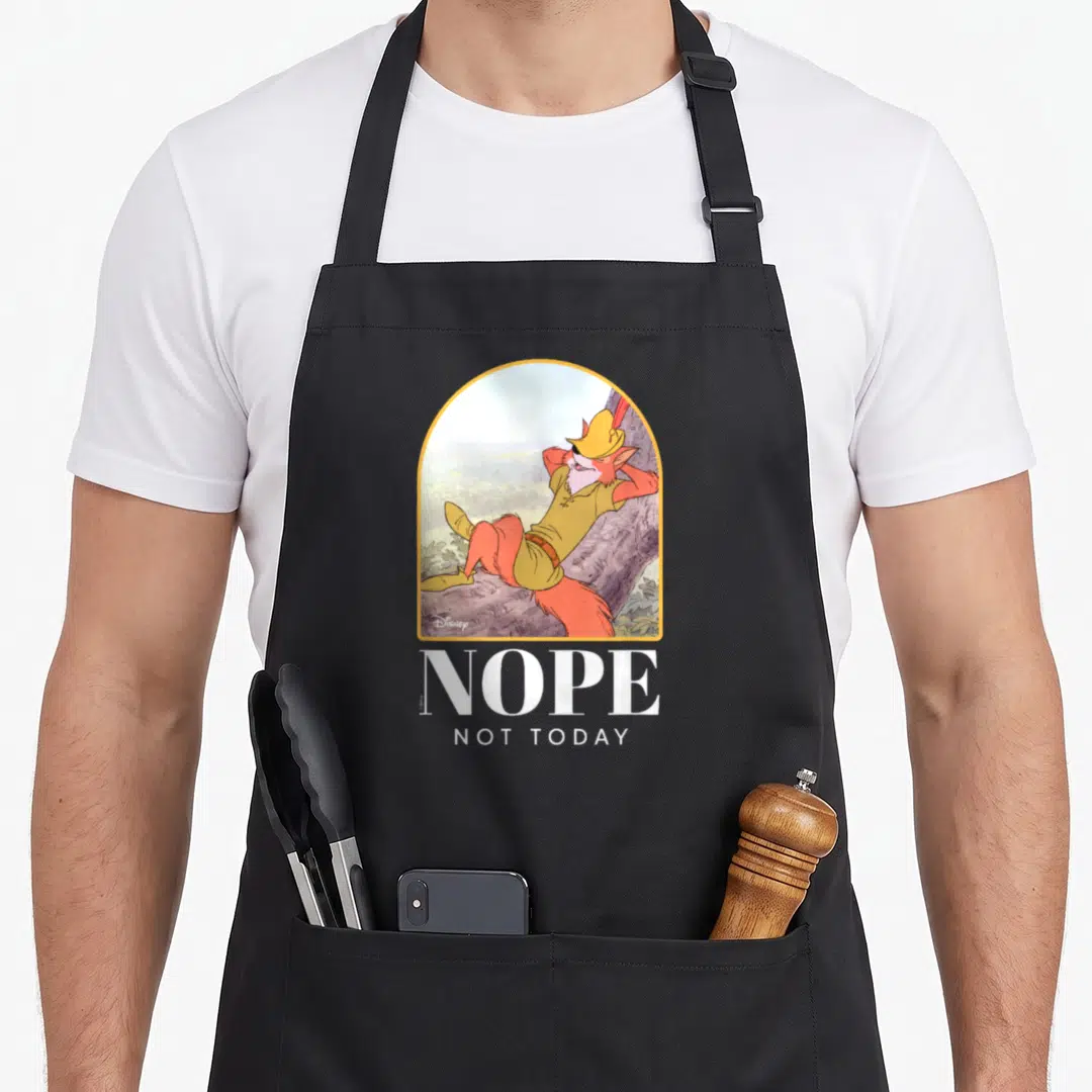 Nope crazy robin man apron - Cartoon fox reclining in arch above white text NOPE NOT TODAY — shown on a black cotton canvas apron against a white background