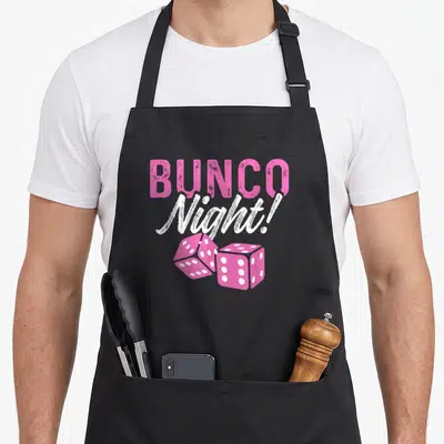 Bunco night game aprons - Pink dice and BUNCO Night! text in stacked typography layout — shown on a black cotton canvas apron against a white background