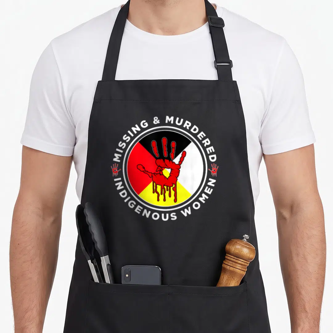 Mmiw wheel apron - Red handprint on four color quadrants surrounded by Missing & Murdered Indigenous Women text — shown on a black cotton canvas apron against a white background