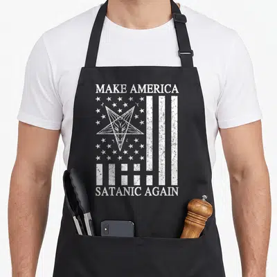 Satanic satay apron - Distressed white Baphomet pentagram and stripes with text Make America Satanic Again — shown on a black cotton canvas apron against a white background