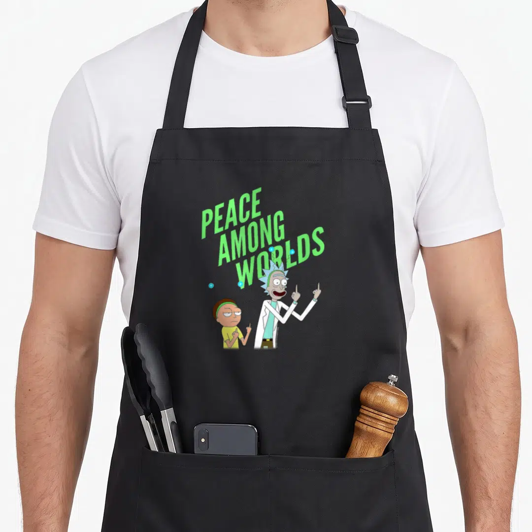Peace novelty apron - PEACE AMONG WORLDS text above Rick and Morty with antennae and pointing fingers — shown on a black cotton canvas apron against a white background