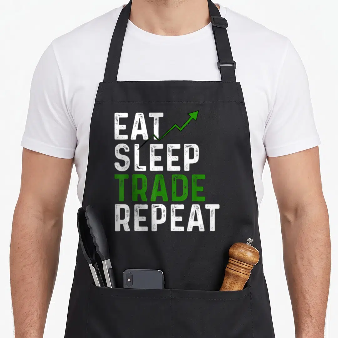 Trading stock aprons - EAT SLEEP TRADE REPEAT text with green upward arrow on white background — shown on a black cotton canvas apron against a white background