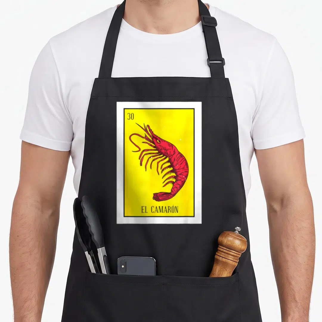Camaron mexican apron - Red shrimp on yellow field with black border, number 30 top left, EL CAMARÓN text bottom — shown on a black cotton canvas apron against a white background