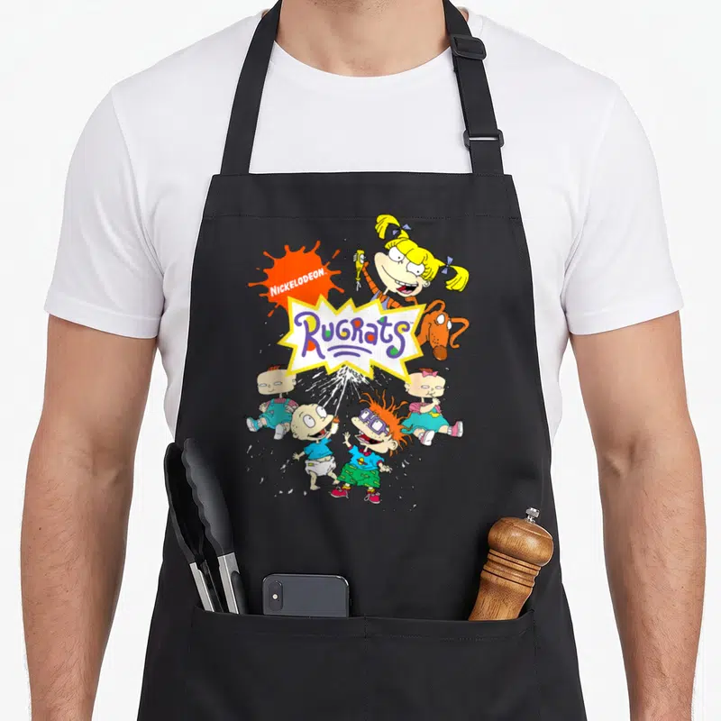 Nick character aprons - Rugrats logo with Angelica, Spike, Tommy, Chuckie, Phil, and Lil in cartoon style — shown on a black cotton canvas apron against a white background