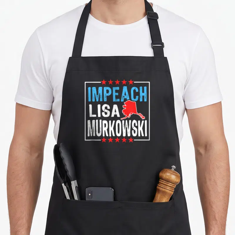 Impeach senator apron - Red Alaska map and stacked text IMPEACH LISA MURKOWSKI in distressed blue and white — shown on a black cotton canvas apron against a white background