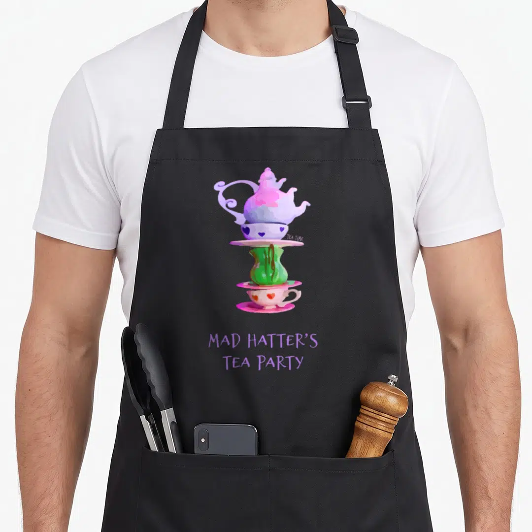 Hatter tea party aprons - Watercolor stack of purple teapot, green vase, and pink cup with hearts and text — shown on a black cotton canvas apron against a white background