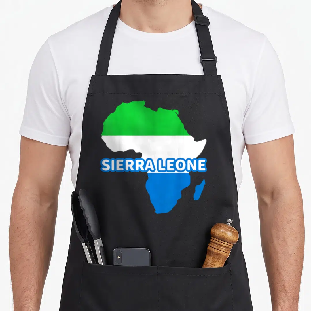 Sierra pride apron - Africa map filled with green white blue flag stripes and SIERRA LEONE text centered — shown on a black cotton canvas apron against a white background