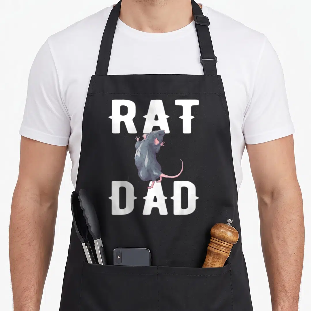 Owner daddy apron - Realistic grey rat standing between white RAT and DAD text — shown on a black cotton canvas apron against a white background