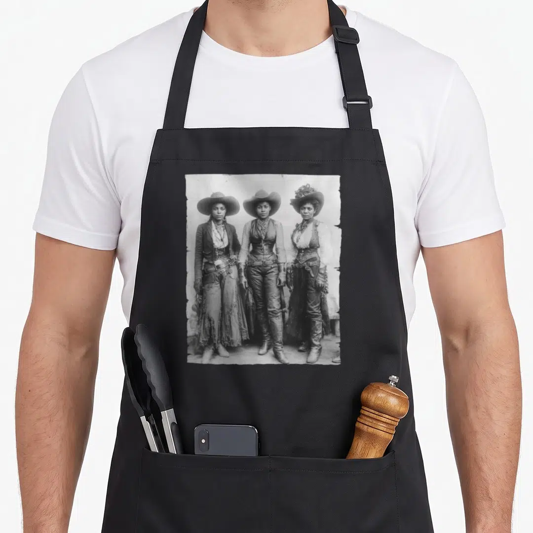 African western apron - Photo of three cowgirls facing forward in black white grey — shown on a black cotton canvas apron against a white background