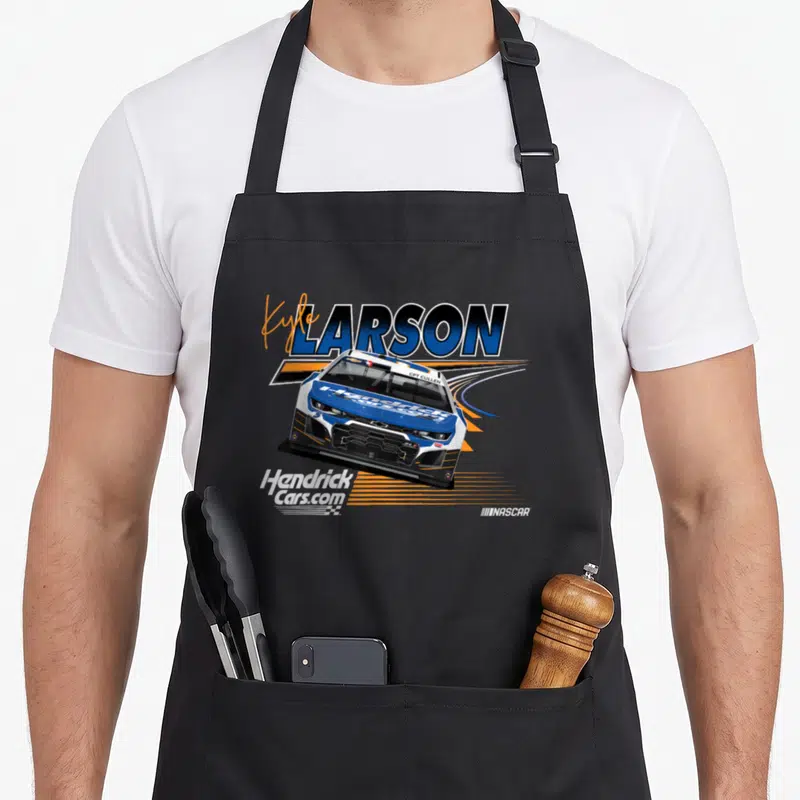 Nascar line apron - Race car in white blue orange with Kyle Larson and HendrickCars.com text — shown on a black cotton canvas apron against a white background