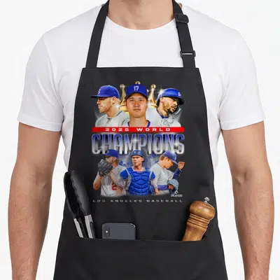 Champion half player apron - Six baseball players surrounding 2025 World Champions text and gold crown on grey — shown on a black cotton canvas apron against a white background