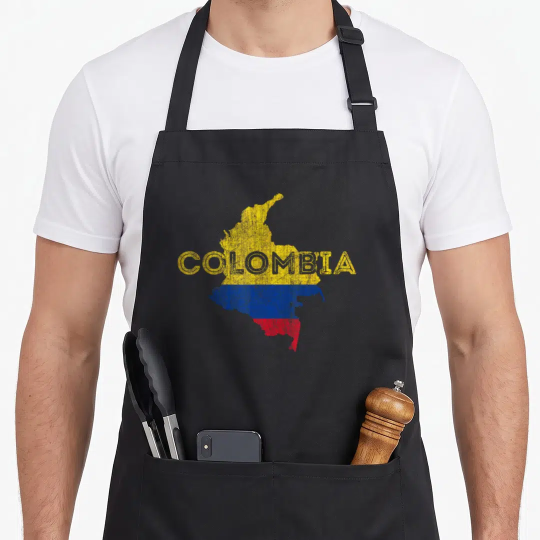 Colombian distressed apron - Map of Colombia filled with yellow blue and red flag colors with text COLOMBIA — shown on a black cotton canvas apron against a white background
