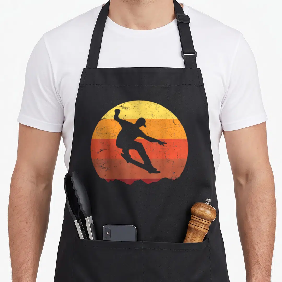 Funny skateboard best skater skateboarder accessories stuff apron - Grey surfer silhouette on striped yellow orange red — shown on a black cotton canvas apron against a white background