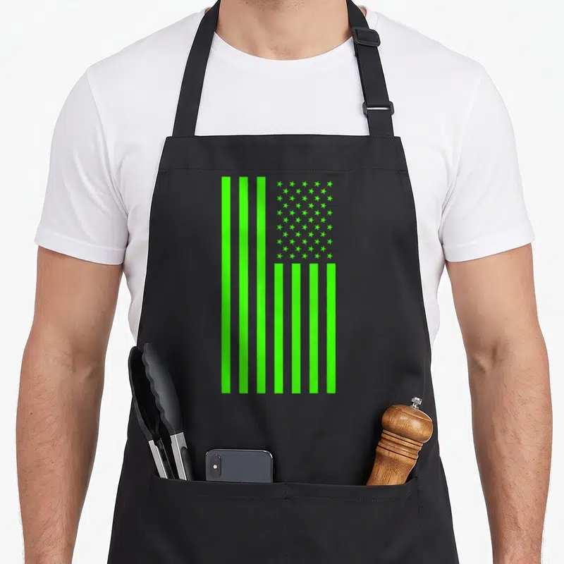 Banner novelty apron - Monochromatic lime green US flag with vertical stripes and stars on grey background — shown on a black cotton canvas apron against a white background