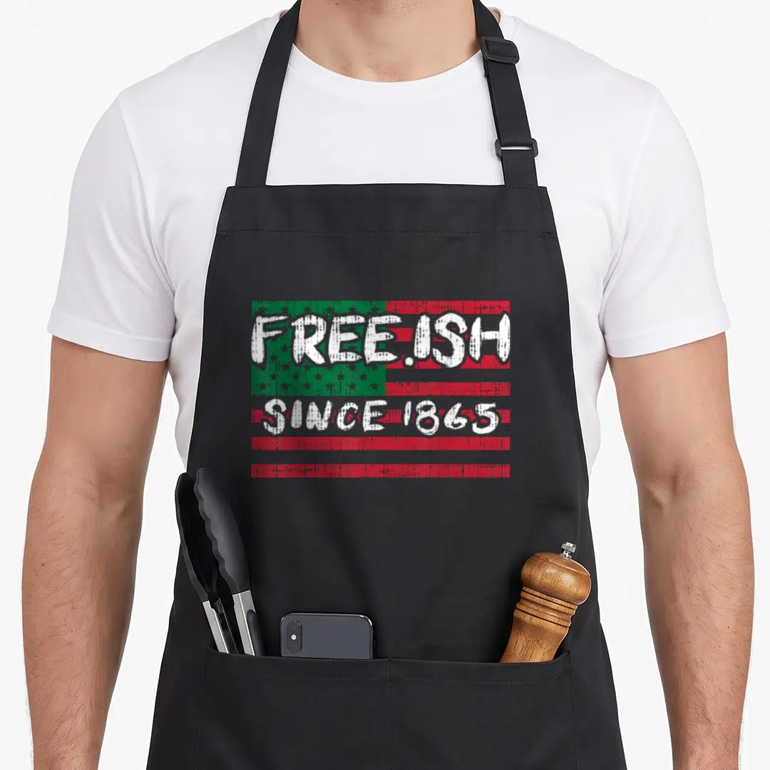 Freeish african apron - Distressed red green and white flag with free ish since 1865 text overlay — shown on a black cotton canvas apron against a white background