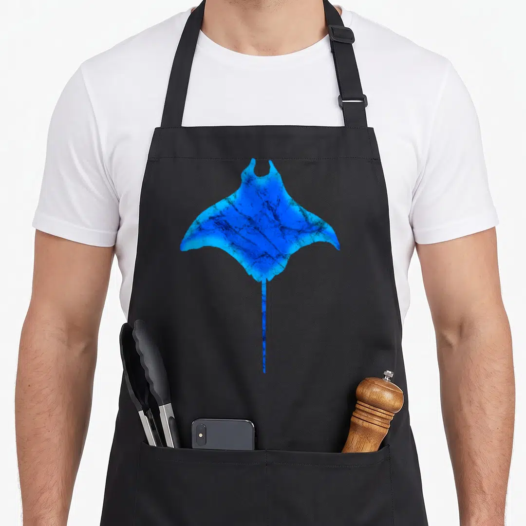 Stingray fishing aprons - Blue realistic stingray graphic centered on black bib apron — shown on a black cotton canvas apron against a white background