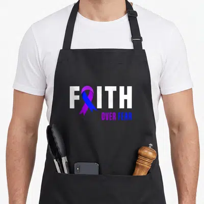 Fighter faith aprons - FAITH OVER FEAR text with purple blue ribbon replacing — shown on a black cotton canvas apron against a white background