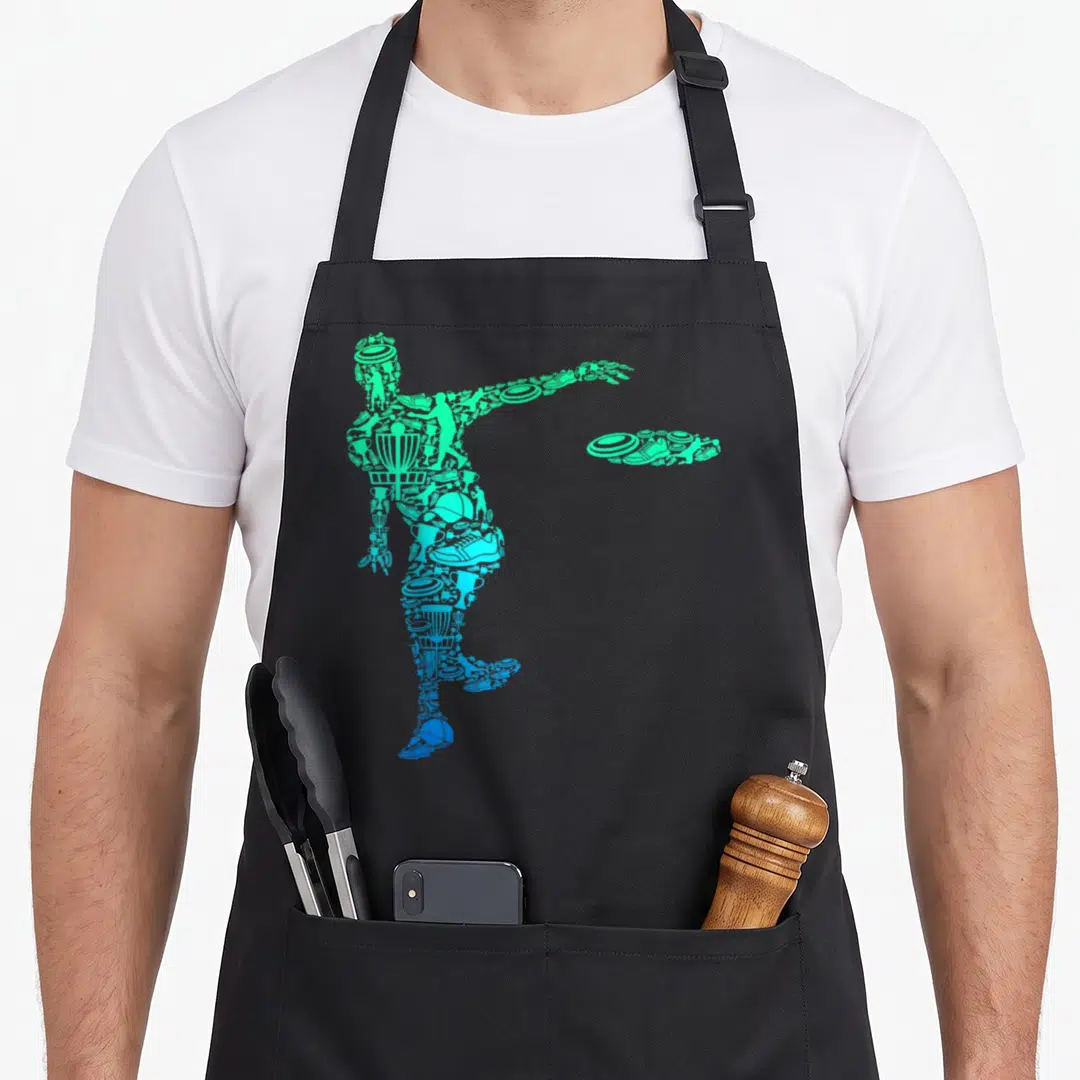 Funny disc golf apron - Green and blue silhouette of a disc golfer formed by small icons including discs and baskets — shown on a black cotton canvas apron against a white background
