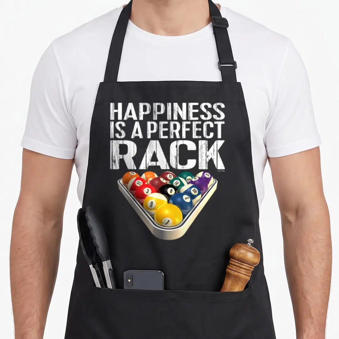Perfect billiards apron - HAPPINESS IS A PERFECT RACK text above triangular rack of colored billiard balls — shown on a black cotton canvas apron against a white background