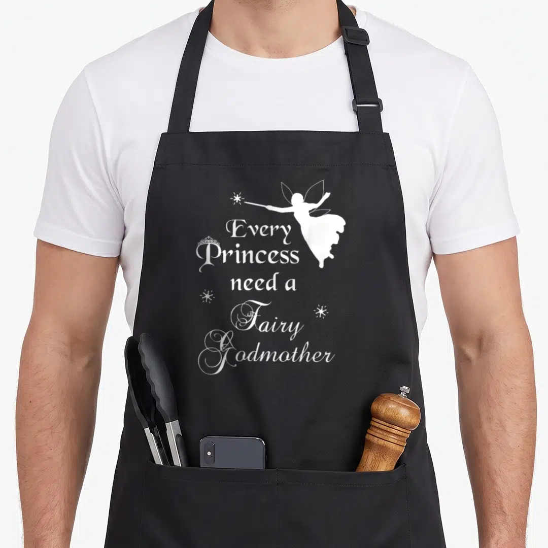 Funny princess fairy godmother apron - White line-art fairy godmother holding wand points top-left beside 'Every — shown on a black cotton canvas apron against a white background