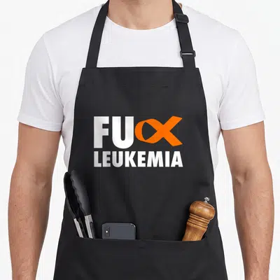Leukemia walking apron - White text FUCK LEUKEMIA with orange ribbon replacing the letter X — shown on a black cotton canvas apron against a white background