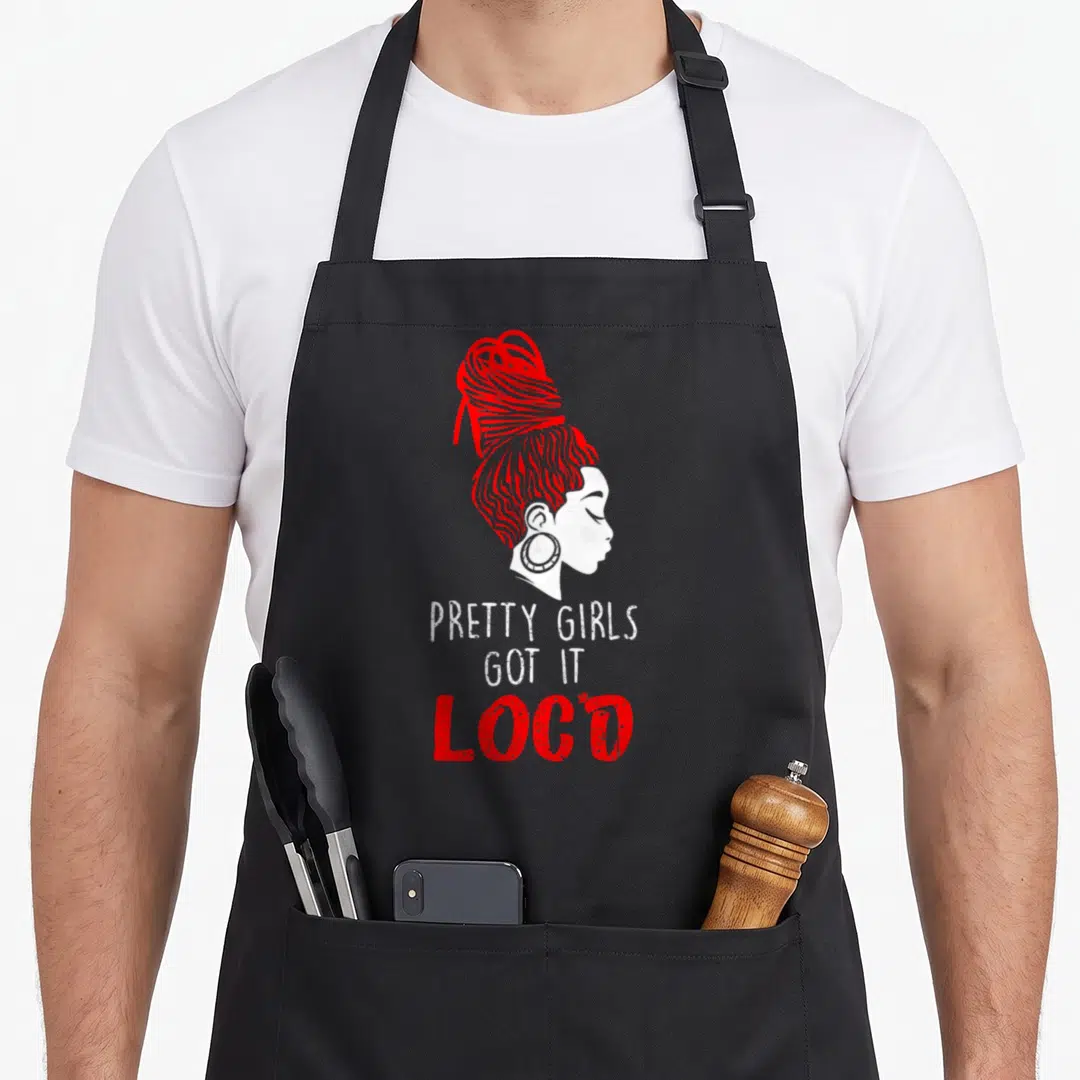 Locd pretty apron - Red profile of woman with high bun above PRETTY GIRLS GOT IT LOCD text — shown on a black cotton canvas apron against a white background