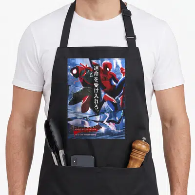 Verse animal apron - Three spider-people in red blue black white with vertical Japanese text and Into the Spider-Verse — shown on a black cotton canvas apron against a white background