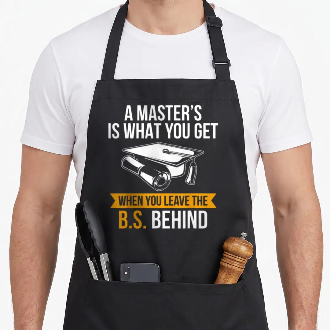 Degree mba master apron - Graduation cap and diploma with white and orange text celebrating a master's degree — shown on a black cotton canvas apron against a white background