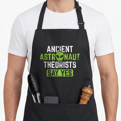 Alien ancient apron - Distressed white and green text reading Ancient Astronaut Theorists Say Yes over alien head — shown on a black cotton canvas apron against a white background