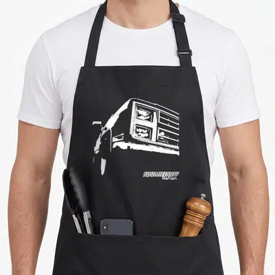 Body truck apron - White truck front silhouette and SQUAREBODY Nation text — shown on a black cotton canvas apron against a white background