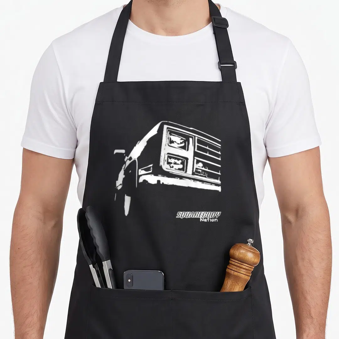 Body truck apron - White truck front silhouette and SQUAREBODY Nation text — shown on a black cotton canvas apron against a white background