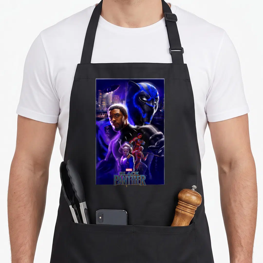 Movie wakanda apron - Black Panther movie poster print with T'Challa, mask, and city in blue purple black gold — shown on a black cotton canvas apron against a white background