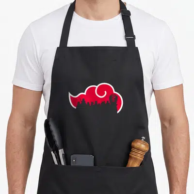 Akatsuki anime apron - Red stylized cloud with white border and grey silhouettes on black apron — shown on a black cotton canvas apron against a white background
