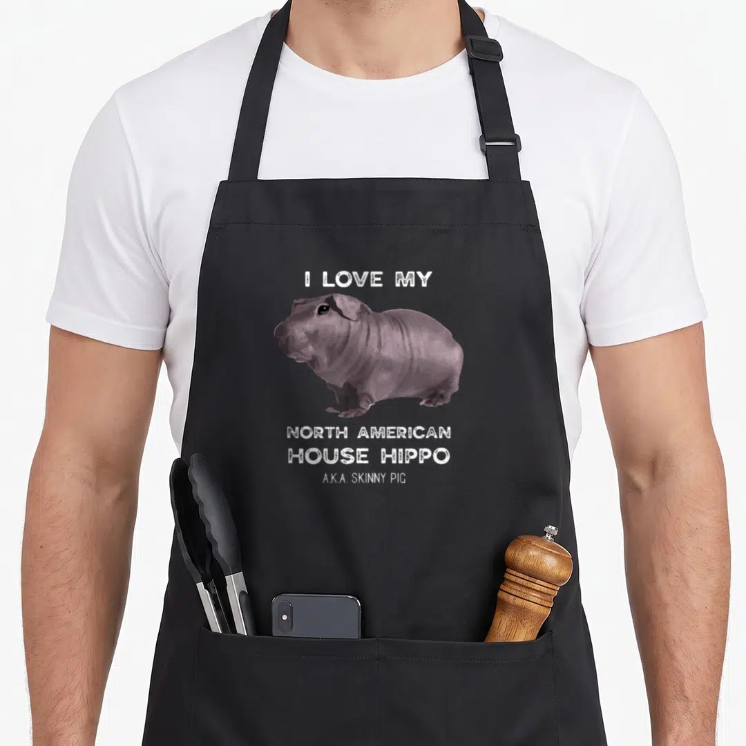 Hippo i love my guinea apron - Grey cartoon skinny pig with white text I Love My North American House Hippo — shown on a black cotton canvas apron against a white background