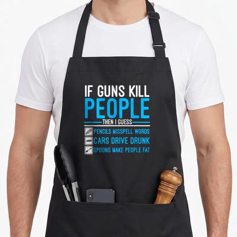 Kill gun apron - Stacked text about pencils cars and spoons with three small icons on black fabric — shown on a black cotton canvas apron against a white background