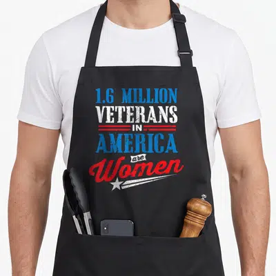 Million afghanistan apron - Stacked text 1.6 million veterans in America are women with red lines and white star swoosh — shown on a black cotton canvas apron against a white background